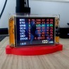 Socle NM Miner BTC en fonctionnement - le mineur allumé sur son support rouge