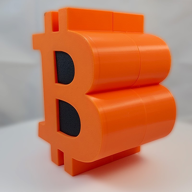 Tirelire Bitcoin en impression 3D - tirelire orange en forme de logo BTC avec fente à pièces