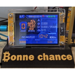NM Miner allumé sur son socle Bonne chance - écran couleur en fonctionnement